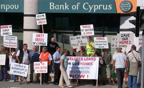 Protestors gather outside the Bank of Cyprus in Paphos